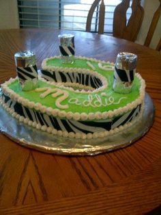 a zebra print birthday cake on a table