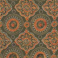 an orange and green paisley print fabric with circular designs on the side, in various colors