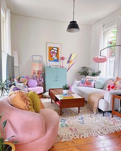 a living room filled with lots of furniture and decor