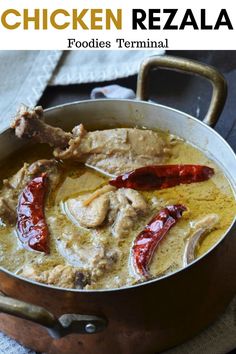 chicken rezala in a pot with red peppers and sauce on the side, ready to be eaten