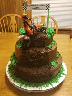 a dirt bike birthday cake on top of a table