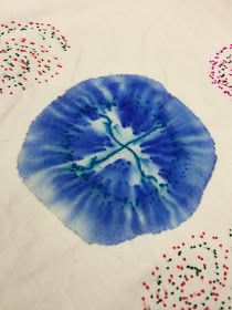 an image of a blue and white object on a table cloth with sprinkles