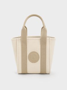 This product is made with at least 20% sustainable materials by weight. CHARLES & KEITH uses recycled, degradable, organic, and water-based materials in our eco-conscious collection. If you love neutral tones, this taupe version of our mini canvas contrast-trim tote bag is not to be missed. It features a classic rectangular silhouette and convenient magnetic closure that ensures easy access to all your daily essentials. Crafted from lightweight and durable canvas, this bag is designed to ... Brand Collaboration, Charts For Kids, Consumer Protection, Printables Kids, Contrast Trim