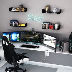 a computer desk topped with two monitors next to a keyboard and mouse on top of a white table