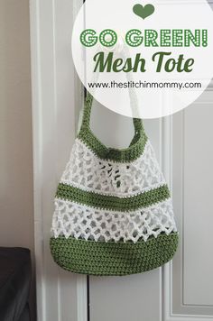 a green and white crocheted bag hanging on a door handle with the words go green mesh tote