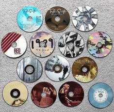 many different cd's are arranged on the floor in order to be readable