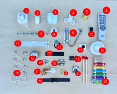 the contents of an electronic device laid out on top of a wooden table with numbers