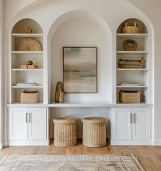 a living room with white shelves and baskets on top of them, along with an area rug