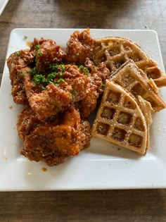 fried chicken and waffles on a white plate