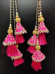 15" wedding fuchsia pink indian bridal lehenga embellishment zardosi decorative hanging tassel | silk fabric wedding tassel with bead chainHandmade Hanging/tasselsMaterial:Silk, Thread, MotifsPackage Contents: 2Key Features:Embroidery art workThis  is good match with both Indian and western outfits and are superb for wedding and festive parties.This would be best complement to your designer saree, lenhga or any other kind of dress.This is the combination of traditional and modern embroidery work Pink Kundan Embroidered Fabric For Wedding, Pink Embroidered Fabric With Dori Work For Reception, Traditional Pink Silk Thread Choli, Pink Traditional Wear With Dori Work, Festive Chandbali Jhumkas With Dori Work, Festive Dori Work Jhumkas For Diwali, Festive Diwali Jhumkas With Dori Work, Bollywood Style Jhumkas With Dori Work For Diwali, Bollywood Jhumkas With Dori Work For Diwali