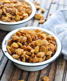 two bowls filled with cereal on top of a wooden table