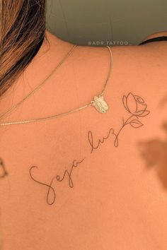 the back of a woman's neck with writing on it that says, sorry