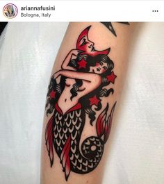 a woman's arm with a mermaid tattoo on it, and an arrow in the shape of a star