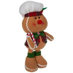 a stuffed animal with a chef's hat and scarf on it's head