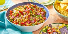 corn salsa and tortilla chips on a wooden table