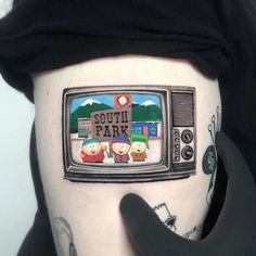 a person with a tattoo on their stomach that says south park