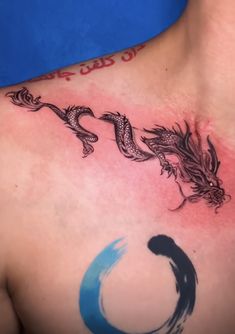 a man with a dragon tattoo on his chest