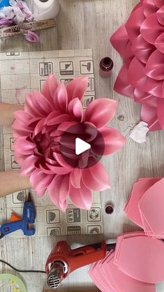 paper flowers being made with scissors and glue