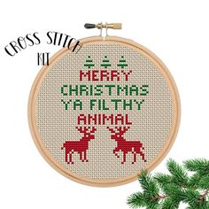 a cross stitch pattern with the words merry christmas ya filthy animal