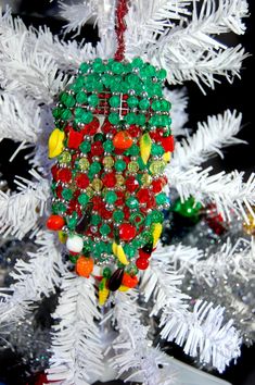 a christmas ornament hanging from a white tree