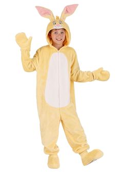 a young boy in a bunny costume is smiling and posing for the camera with his arms out