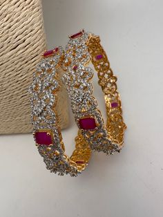 Traditional Bangles comes in set of 2Color : Golden DiamondSize : Size : 2.4Stones : AD Green Stone Traditional Bangles, Golden Diamond, Red Stone, Green Stone, Ruby Red, Indian Jewelry, Floral Pattern, Ruby, Bangles