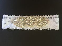 "Highest quality crystal rhinestone applique for use in creating a custom baby headband, hair piece, bridal garter, or accent to any garment. Applique is made with clear crystal rhinestones in a silver setting. Resin backing for hotfix/iron on/sew on. 4\" long by 1\" wide Crystal Trimmings & Appliques is a wholesale distributor of high-end bridal trim. Larger quantities are available by request, or custom orders are welcome. Please note that as these are trim/applique only, and not attached White Crystal Bridal Accessories With Adjustable Fit, Silver Crystal Embellished Jewelry Headband, Silver Rhinestone Jewelry Headband, Bedazzled White Crystal Jewelry, White Wedding Jewelry Headband, Adjustable White Rhinestone Jewelry, White Crystal Bridal Accessories With Rhinestones, Diy Baby Headband, Bridal Trim