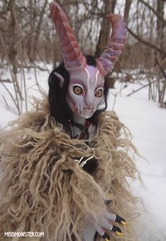 a person wearing a goat costume in the snow