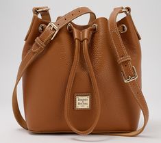 Take note: the Lucca drawstring crossbody lets you try fashion's hot modern prep aesthetic while relishing in timeless Dooney & Bourke craftsmanship. Grab the attractive pebble leather bag as a first-time purchase (finally!), an addition to your beloved collection, or a gift for the next generation (such a thoughtful auntie!). From Dooney & Bourke. Classic Pebbled Leather Bucket Bag For Travel, Pebbled Leather Crossbody Bucket Bag With Adjustable Strap, Classic Pebbled Leather Bucket Bag, Pebbled Leather Crossbody Bucket Bag For Travel, Prep Aesthetic, Mally Beauty, Adaptive Clothing, Fitness Gifts, The Next Generation