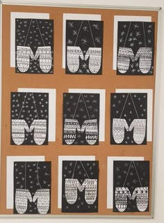 a bulletin board with black and white pictures on it