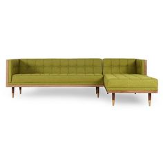 a green couch with wooden legs and a chaise lounge in front of a white background