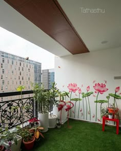 a balcony with potted plants on the grass