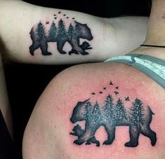 two people with tattoos on their stomachs, one has a bear and the other has trees