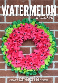 a watermelon wreath made out of paper on a brick wall with the words, watermelon wreath craft