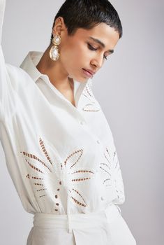 Crafted from soft and breathable cotton poplin, the Lani White Oversized Shirt is a versatile addition to your Resort ensemble. Offering a relaxed fit, it's adorned with pleasing Battenburg embroidery, capturing the essence of a tropical chic mood. Featuring a classic shirt collar, full sleeves with cuff, and a straight hem, the shirt fastens with a front button closure. Embrace the relaxed luxury of resort living with this shirt paired with the Lani White Shorts. Made In India White Embroidered Skirt Swimsuit Coverup, White Oversized Shirt, White Jumpsuit Dress, Resort Living, Hemant And Nandita, Floral Gown, Lace Cutout, Swaggy Outfits, Lace Hem