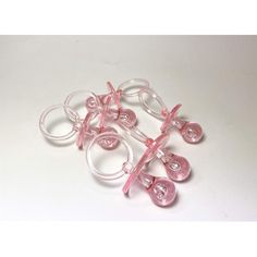 small pink and clear earring set on white background