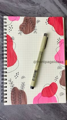 a notepad with a pen on top of it next to a drawing book and pencil