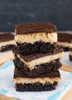 three brownies stacked on top of each other with peanut butter and chocolate frosting