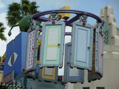 an amusement park ride with colorful doors and windows