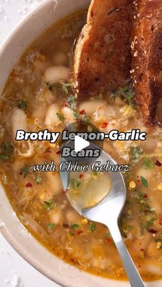 brothy lemon garlic soup with beans in a white bowl