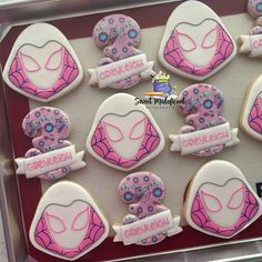 decorated cookies in the shape of female superheros