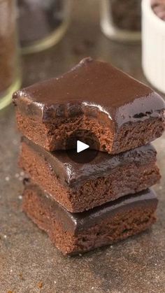 three chocolate brownies stacked on top of each other