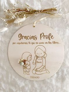 an ornament with a drawing of a woman and child