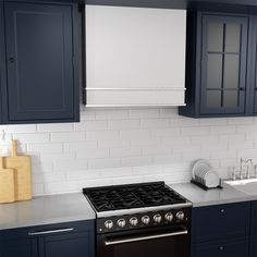 a stove top oven sitting inside of a kitchen next to blue cabinets and counter tops