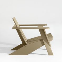 a wooden chair sitting on top of a white floor next to an object that looks like it's made out of wood