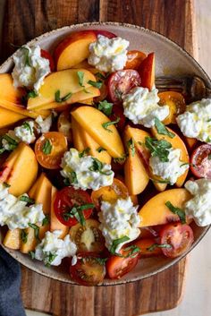 a bowl filled with peaches and cottage cheese