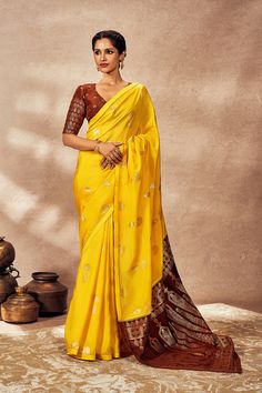 Introducing the brown and yellow jacquard sari, a timeless piece that blends traditional elegance with modern sophistication. The sari features a jacquard weave, edged with kinari for a touch of traditional craftsmanship. The contrast jacquard pallu adds a distinctive element, enhancing its visual appeal. This sari is complemented by a matching brown jacquard blouse, completing the ensemble with understated elegance and versatility. Perfect for formal occasions and cultural celebrations, this sa Jacquard Blouse, Cultural Celebration, Understated Elegance, Jacquard Weave, Only Fashion, Contemporary Fashion, Blouse Piece, Aza Fashion, Formal Occasion