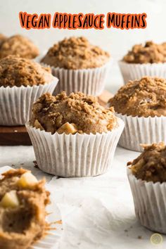 several muffins are sitting on a table with the words vegan applesauce muffins above them