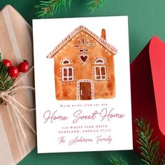 a christmas card with a gingerbread house on it