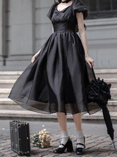 Step into elegance with our black boned high waist dress, a timeless piece that exudes sophistication and grace. Inspired by the iconic style of Audrey Hepburn, this little black dress features a flattering high waist and delicate puff sleeves, adding a touch of feminine charm to the classic silhouette. Crafted with attention to detail, the boned structure provides a structured and tailored fit, ensuring a refined look for any occasion.   Please note that this product includes only one dress. Garment Size SizeSMLXLShoulders35363738Bust84889296Sleeve Length20.7 2121.321.6Waist66707478Full Length106107.5109111.5 Evening Fit And Flare Corset Dress, Elegant Cocktail Fit And Flare Corset Dress, Elegant Cocktail Corset Dress Fit And Flare, Elegant Evening Corset Dress With Fit And Flare, Elegant Spring Corset Dress For Banquet, Spring Elegant Banquet Corset Dress, Spring Banquet Elegant Corset Dress, Elegant Spring Banquet Corset Dress, Black A-line Midi Dress With Fitted Bodice